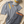 Flat lay Dogleg — tenue de golf orange et gris, style Swiss golf