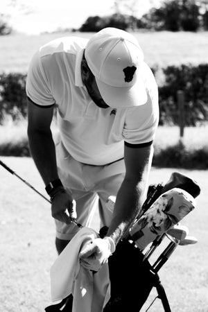 Tour Polo Homme Dogleg — Vert, en situation sur le parcours