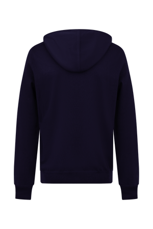 Hoodie Dogleg Clubhouse homme navy porté par un golfeur — hoodie cachemire, golf Suisse