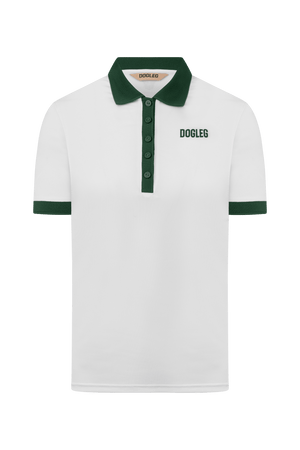 Polo de golf Dogleg Tour femme blanc et vert porté par une golfeuse — golf Suisse