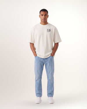T-shirt Dogleg homme, crème, porté de face avec le motif 13